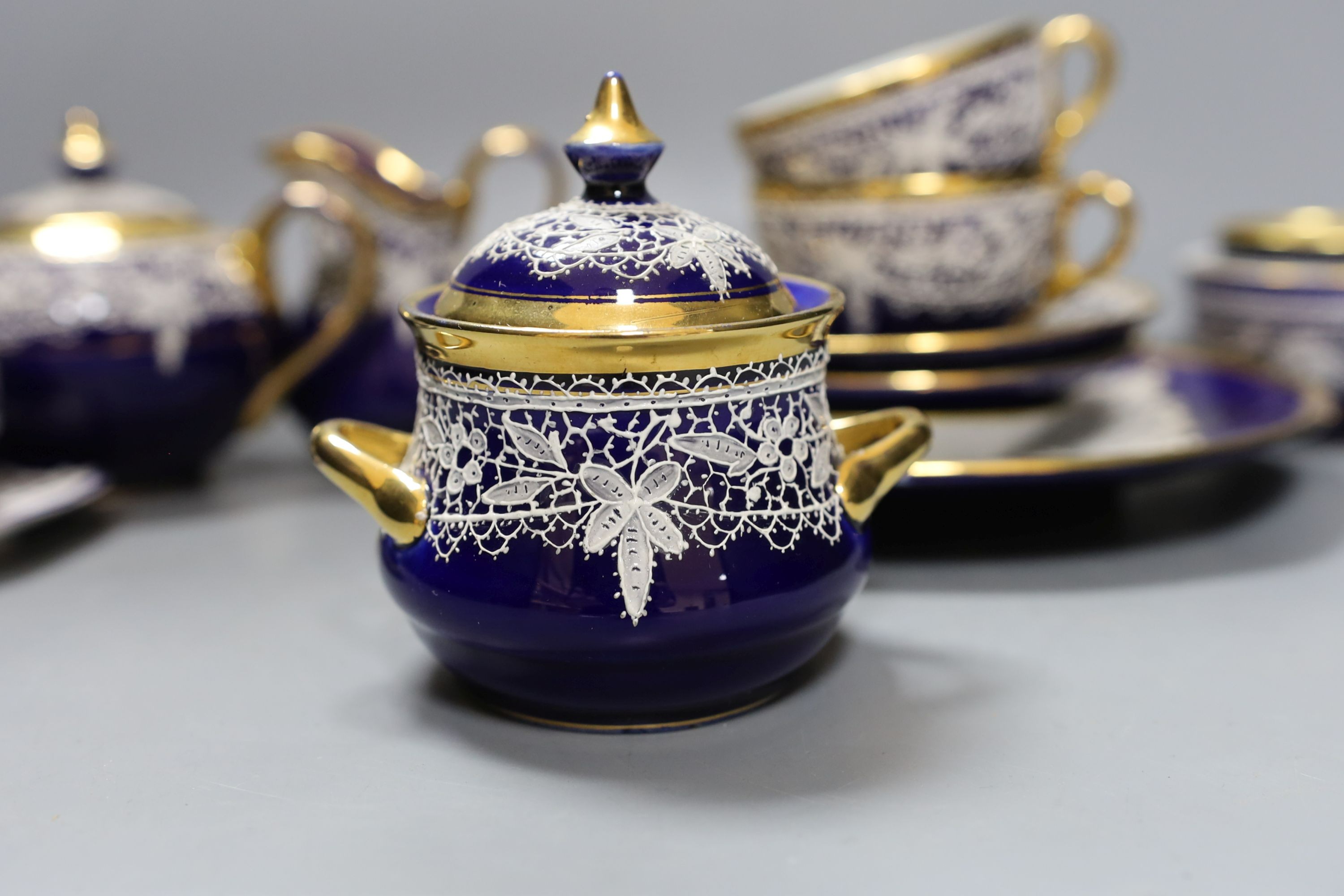 A group of Venetian Lace pattern enamelled blue glazed porcelain teaware (13)